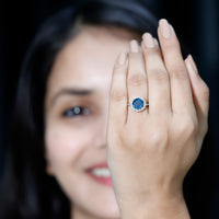 Rosec Jewels 2 Carat round London Blue Topaz engagement ring with diamond halo, showcasing a stunning blue gemstone and sparkling accents
