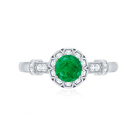 Vintage-inspired emerald engagement ring with diamond accents from Rosec Jewels, featuring a detailed band and vibrant green gemstone.