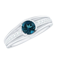 Genuine London Blue Topaz engagement ring with diamond side stones, featuring a silver band and intricate detailing.