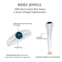 Rosec Jewels London Blue Topaz engagement ring with diamond side stones, featuring a stunning blue gemstone and sparkling accents.