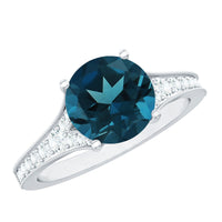 Natural London Blue Topaz and diamond engagement ring by Rosec Jewels featuring a central blue topaz gemstone with diamond accents.