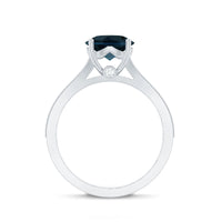 Natural London Blue Topaz and diamond engagement ring featuring a large blue gemstone surrounded by sparkling diamonds, set in a silver band.