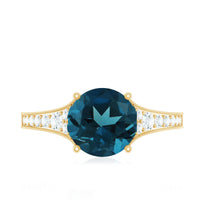 Natural London Blue Topaz and diamond engagement ring from Rosec Jewels, featuring a central blue topaz gemstone and sparkling diamonds.
