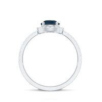 0.7 Carat Pear Shape London Blue Topaz Teardrop Engagement Ring with Diamond Halo