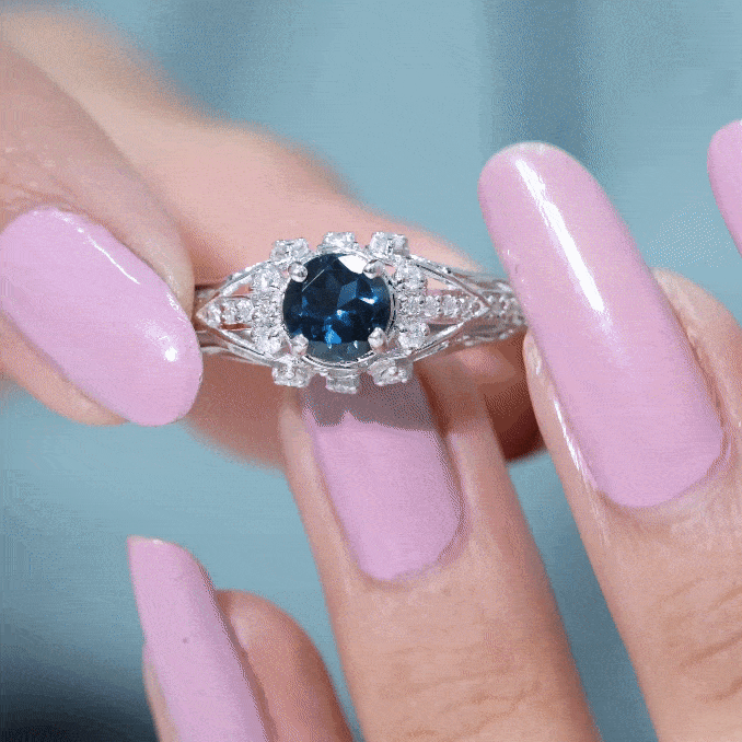 Round 1.3 carat London Blue Topaz engagement ring with vintage design and diamond accents by Rosec Jewels.