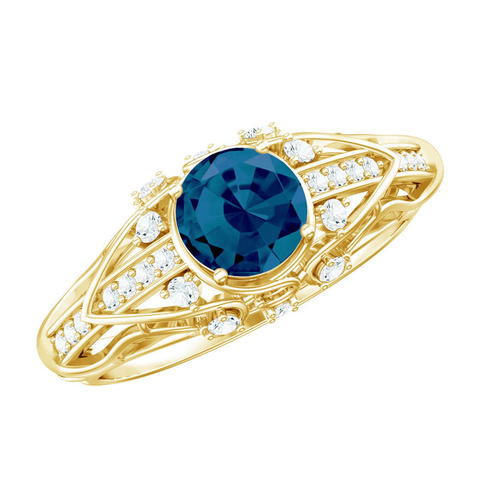 Round London Blue Topaz engagement ring with vintage design and diamond accents by Rosec Jewels, showcasing intricate craftsmanship.