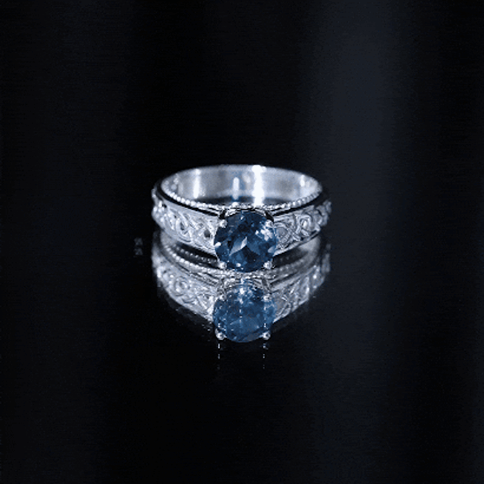 Round 1.35 carat London Blue Topaz vintage engagement ring with Celtic band, crafted by Rosec Jewels.