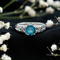 Round 1.35 carat London Blue Topaz vintage engagement ring with Celtic-style band by Rosec Jewels