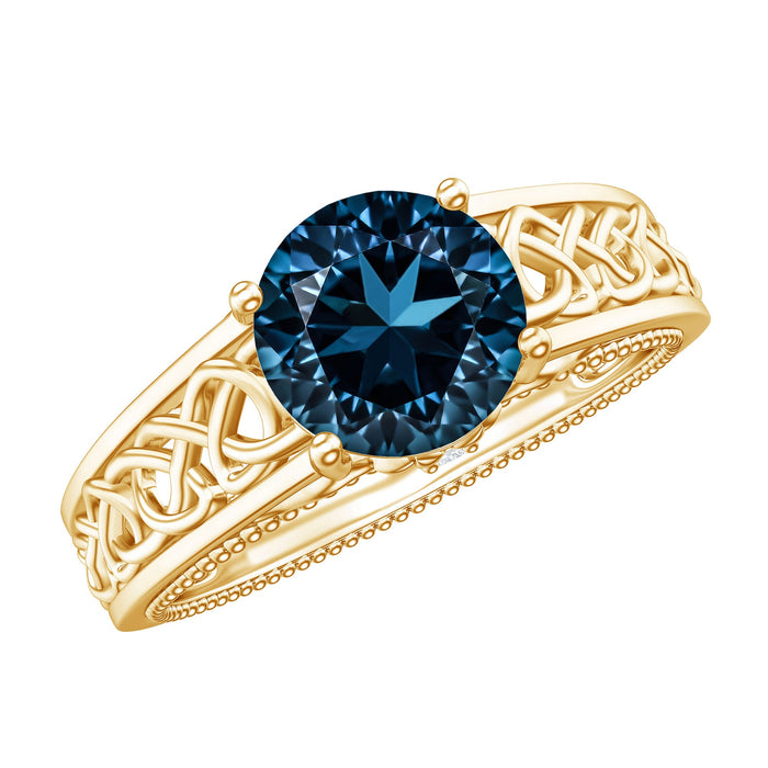 Round 1.35 carat London Blue Topaz vintage engagement ring with Celtic style band by Rosec Jewels, detailed gold design.