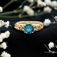 Round London Blue Topaz vintage engagement ring with Celtic-style band, featuring a 1.35 carat center stone, by Rosec Jewels.