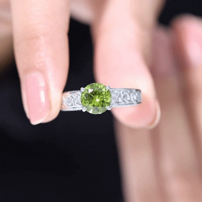 Yellow gold Celtic knot engagement ring with a 2-carat peridot and a hidden diamond accent, by Rosec Jewels.