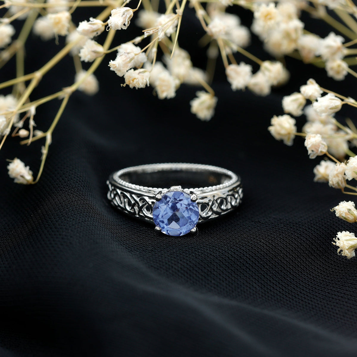 Rosec Jewels 1.6 carat lab-created tanzanite engagement ring with intricate Celtic design, showcasing the vibrant blue gemstone and detailed band.