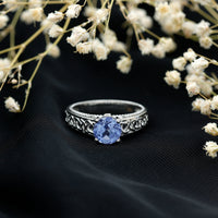 Rosec Jewels 1.6 carat lab-created tanzanite engagement ring with intricate Celtic design, showcasing the vibrant blue gemstone and detailed band.