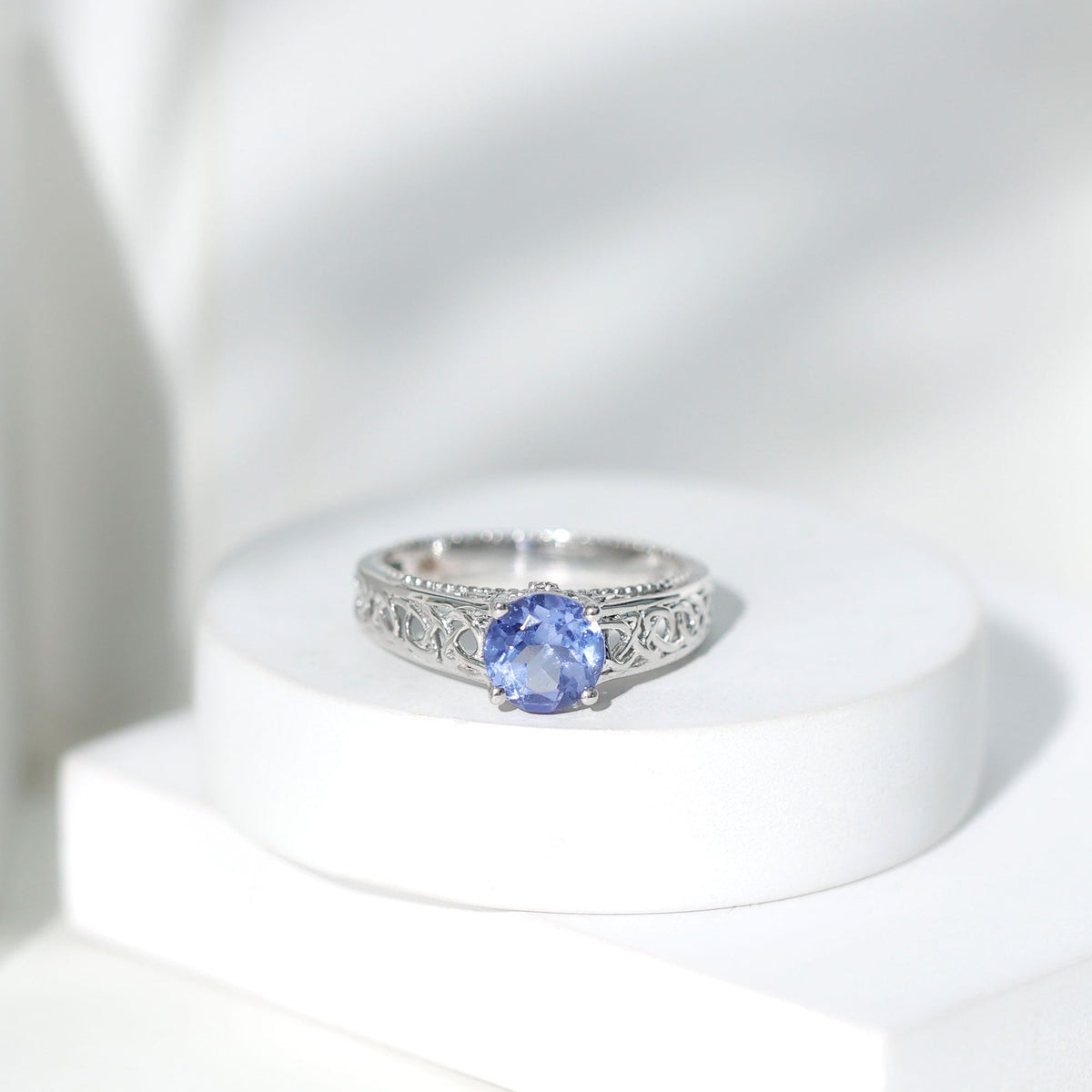Rosec Jewels 1.6 carat lab-created tanzanite engagement ring with Celtic-inspired design, showcasing intricate metalwork and vibrant gemstone.