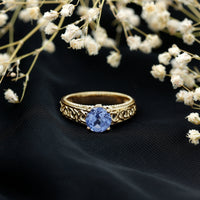 Rosec Jewels 1.6 Carat Lab Created Tanzanite engagement ring with intricate Celtic design and silver band.