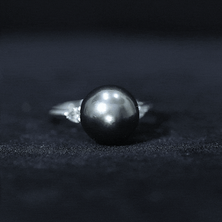 Round Tahitian pearl solitaire engagement ring with Moissanite, featuring a sleek band and elegant design by Rosec Jewels.