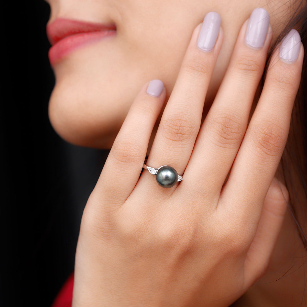 Round Tahitian pearl solitaire engagement ring with moissanite by Rosec Jewels, showcasing a sleek gold band and elegant pearl centerpiece.