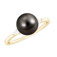 Round Tahitian Pearl solitaire engagement ring with moissanite by Rosec Jewels, showcasing the elegant pearl and sparkling gemstone.