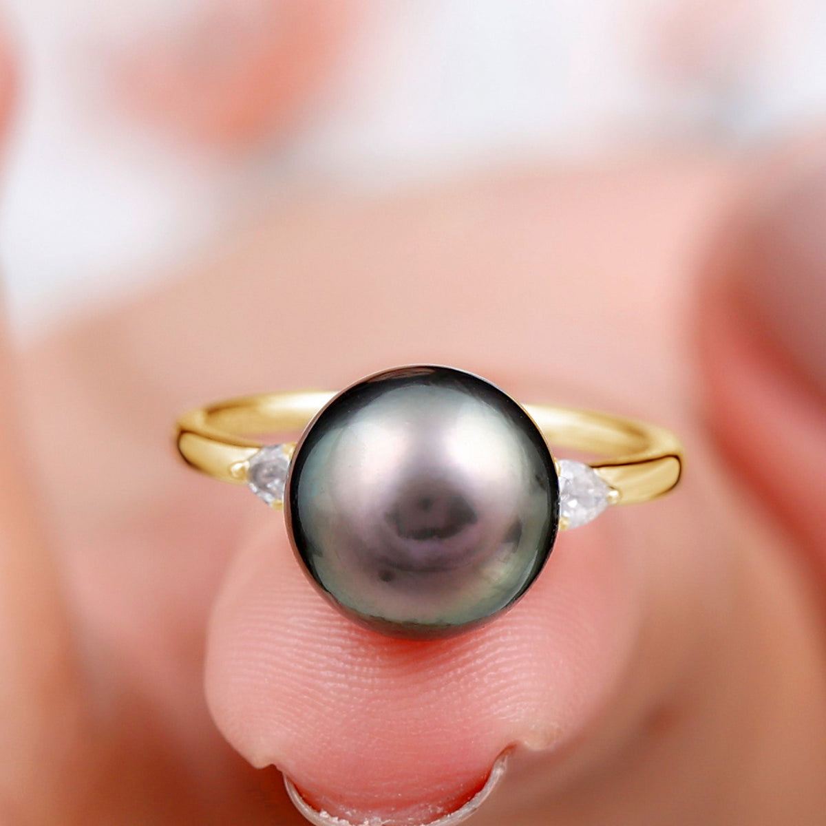 Round Tahitian pearl solitaire engagement ring with moissanite, featuring a sleek band and elegant design by Rosec Jewels.