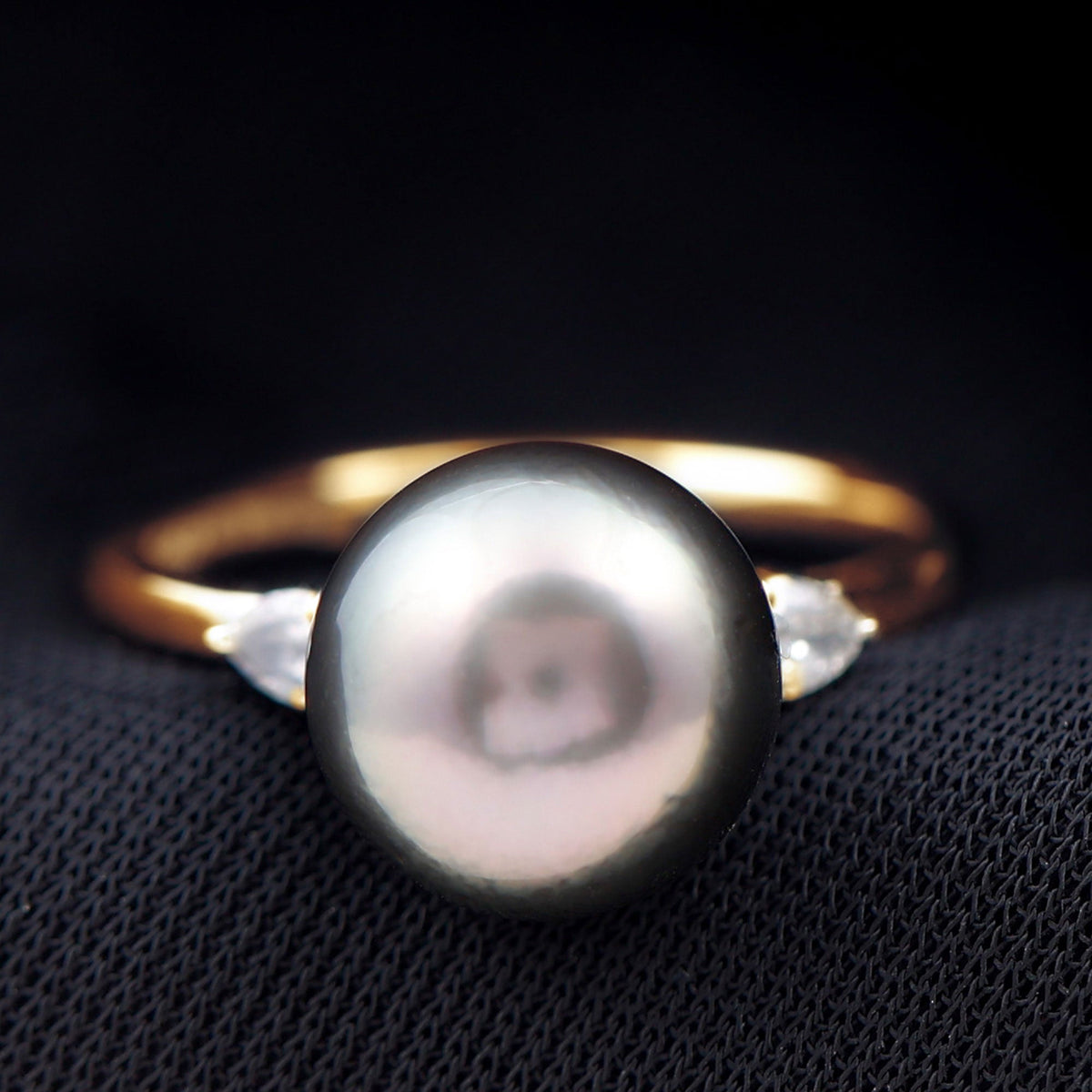 Round Tahitian Pearl solitaire engagement ring with moissanite set in a silver band, elegant jewelry piece by Rosec Jewels.