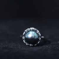 8 carat Tahitian black pearl solitaire engagement ring with floral setting by Rosec Jewels, showcasing the elegant ring design.