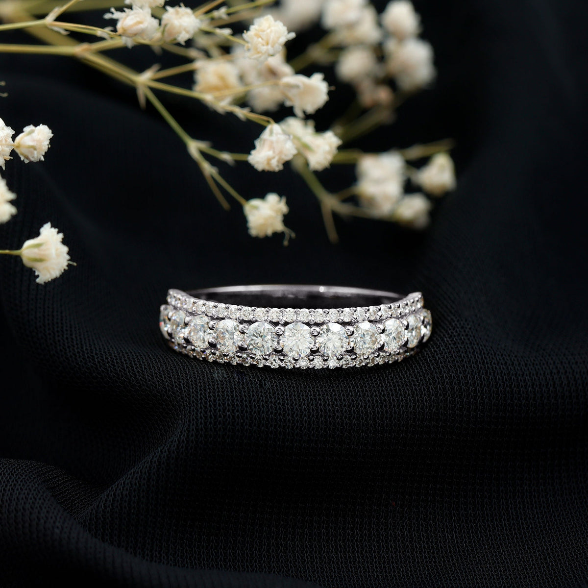 Round shape moissanite half eternity wedding band by Rosec Jewels, showcasing sparkling stones set in a sleek ring design.
