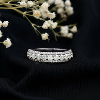 Round shape moissanite half eternity wedding band by Rosec Jewels, showcasing sparkling stones set in a sleek ring design.