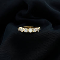 2.2 Carat Round Moissanite Half Eternity Ring in Bezel Setting