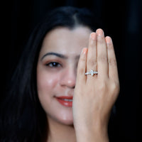 Marquise cut moissanite engagement ring with side stones, featuring a sterling silver band and elegant design by Rosec Jewels.