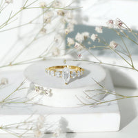 Marquise cut moissanite engagement ring with side stones from Rosec Jewels featuring a sparkling center stone and elegant band.