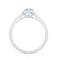 Natural aquamarine engagement ring with diamond halo from Rosec Jewels, showcasing a sparkling center stone and intricate band details.