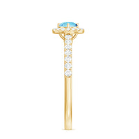 Certified natural aquamarine engagement ring with diamond halo, featuring a silver band and intricate gemstone setting.