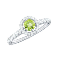 Genuine half carat peridot engagement ring with diamond halo from Rosec Jewels, showcasing a green peridot center and sparkling diamonds.