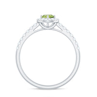 Genuine half carat peridot engagement ring with diamond halo by Rosec Jewels, showcasing the vibrant green gemstone and sparkling diamonds.