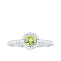 Genuine half carat peridot engagement ring with diamond halo from Rosec Jewels, showcasing the vibrant green peridot center and sparkling diamonds.