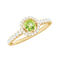 Genuine half carat peridot engagement ring with diamond halo from Rosec Jewels, featuring a green peridot gemstone and sparkling diamonds.