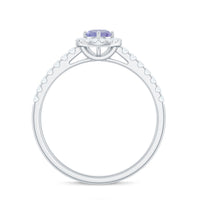 Natural Tanzanite and Diamond promise ring for engagement showcasing a blue Tanzanite center stone with diamond accents in a elegant ring setting.