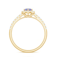 Natural Tanzanite and Diamond promise ring by Rosec Jewels featuring a silver band with a central oval tanzanite gemstone and diamond accents.