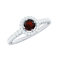 Rosec Jewels garnet minimal engagement ring with diamond halo, featuring a central garnet gemstone and delicate band.
