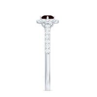 Rosec Jewels garnet minimal engagement ring with diamond halo, showcasing a elegant garnet centerpiece and sparkling diamond accents.