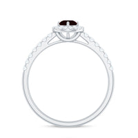 Rosec Jewels Garnet minimal engagement ring with diamond halo, showcasing a central garnet gemstone and delicate ring band.