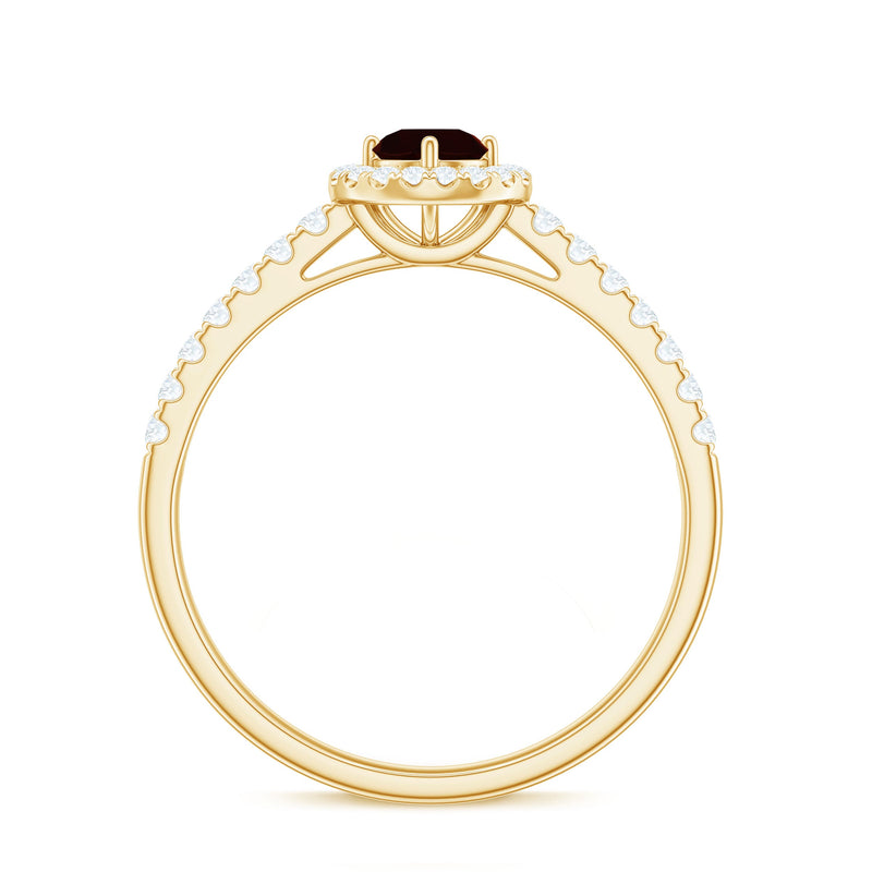 Rosec Jewels garnet engagement ring with diamond halo, featuring a central garnet gemstone and intricate ring design.