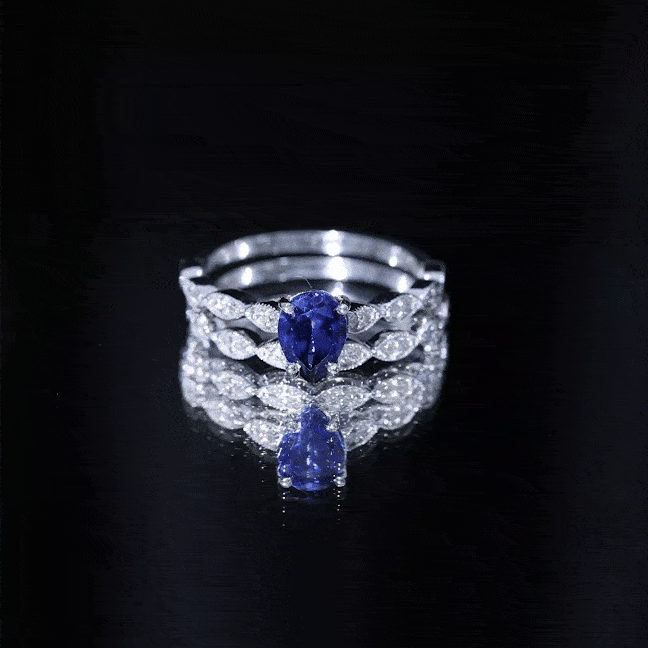 Pear-shaped 1.6 carat blue sapphire engagement ring with diamond band by Rosec Jewels, showcasing a stunning lab-grown gemstone and elegant design.