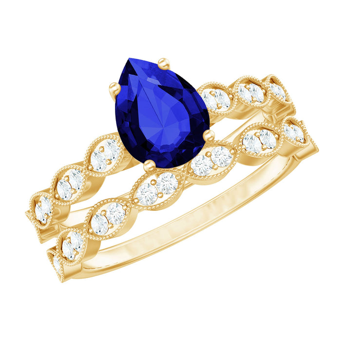 Pear-shaped 1.6 carat blue sapphire engagement ring with diamond band by Rosec Jewels, featuring a stunning lab-grown gemstone.
