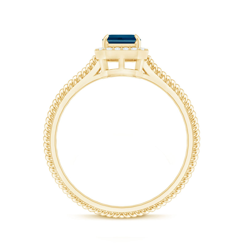 Emerald cut blue topaz engagement ring with diamond halo by Rosec Jewels, featuring a sparkling blue gemstone and intricate band design.