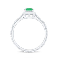 Natural 1.2 carat emerald engagement ring with diamond halo by Rosec Jewels, featuring a central emerald gemstone and sparkling diamonds.