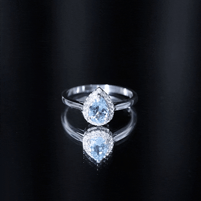 Yellow gold pear-shaped aquamarine engagement ring with diamond halo by Rosec Jewels, showcasing intricate design and sparkling gemstones.