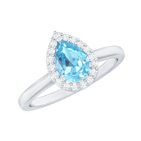 Pear-shaped 1 Carat aquamarine engagement ring with diamond halo by Rosec Jewels, featuring a silver band and intricate detailing.