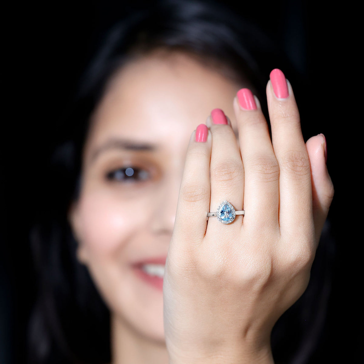 Pear cut aquamarine engagement ring with diamond halo by Rosec Jewels, featuring a 1-carat gemstone and intricate ring design.