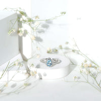 1 Carat pear-shaped aquamarine engagement ring with diamond halo by Rosec Jewels, showcasing the elegant gemstone and sparkling setting.